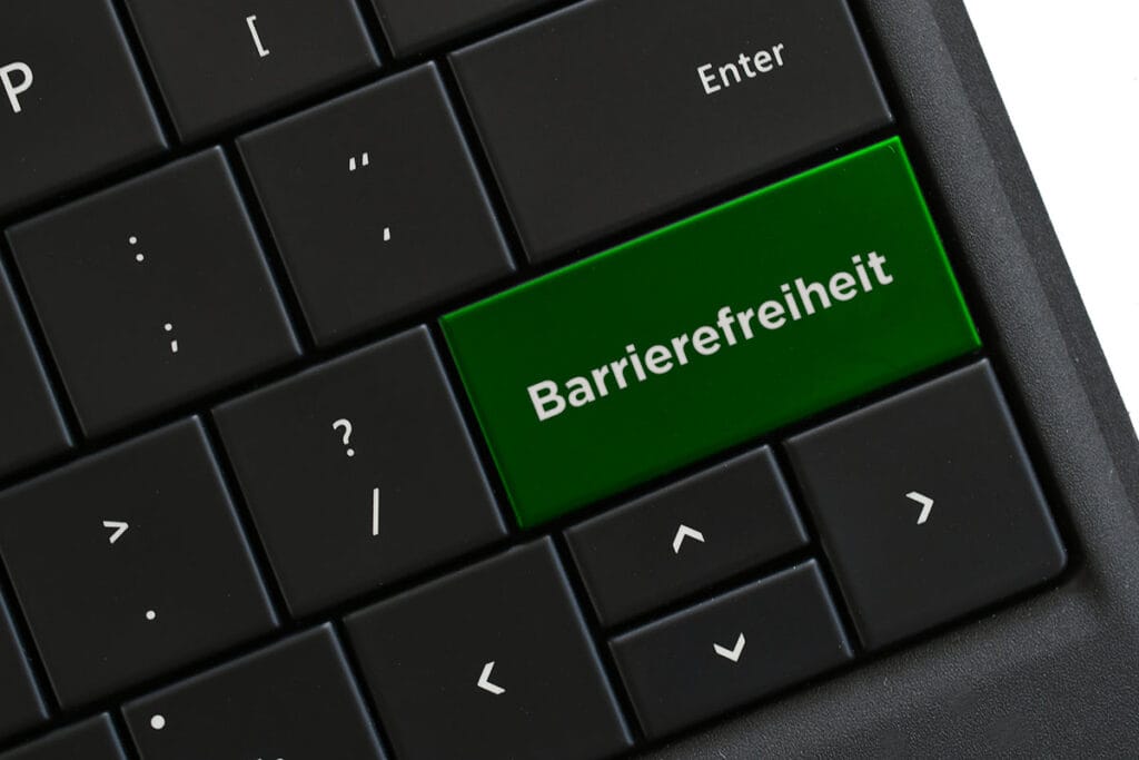 Schwarze Tastatur mit dem Hinweis zur Barrierefreiheit auf der Eingabetaste